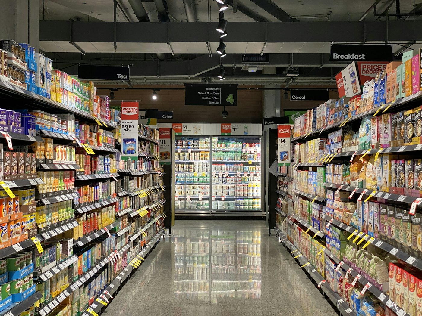 A supermarket aisle stocked floor to ceiling